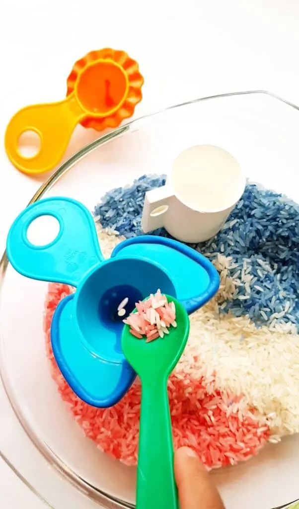 sensory play tray with colored rice
