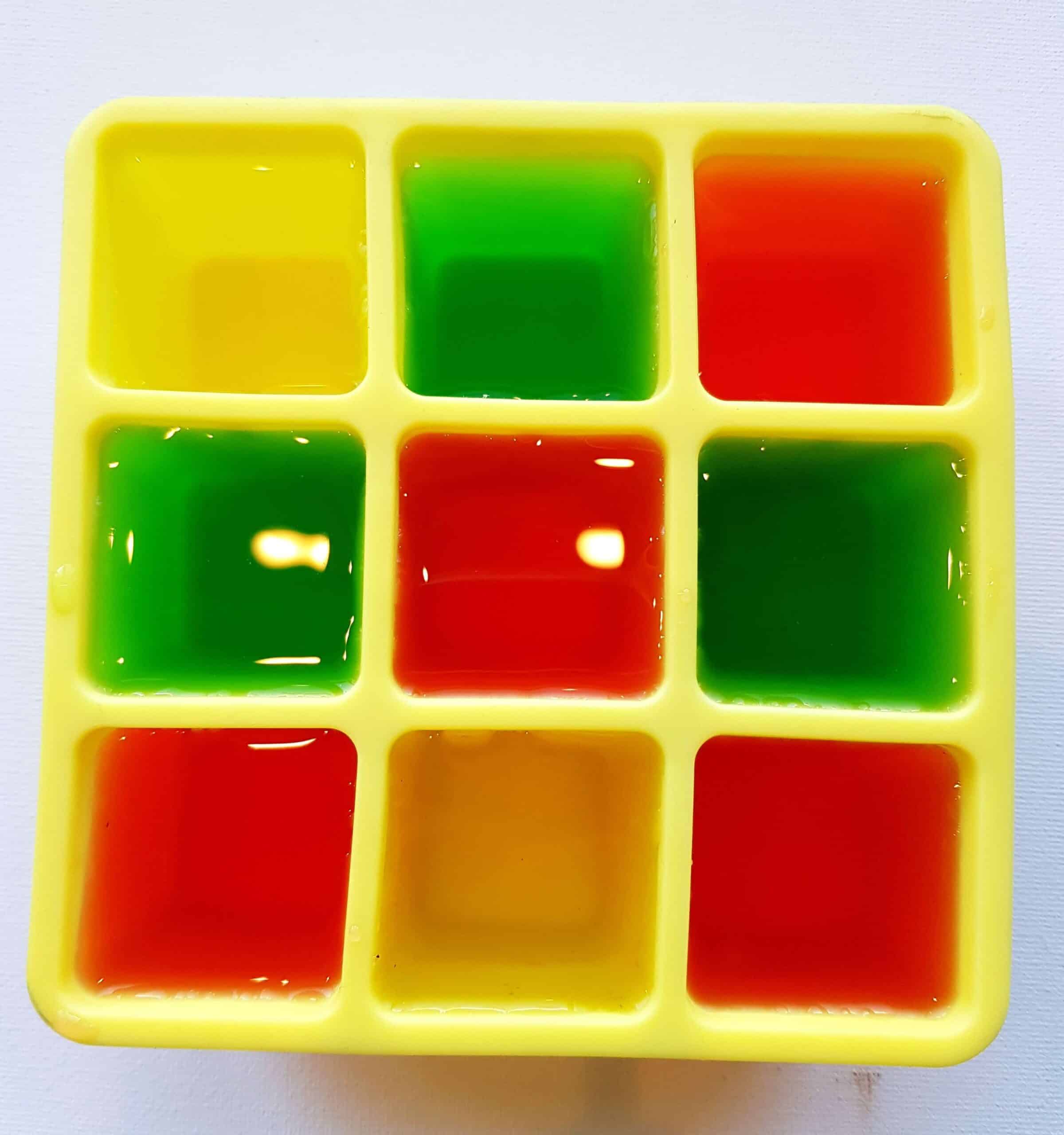 fill ice cube tray with colored water