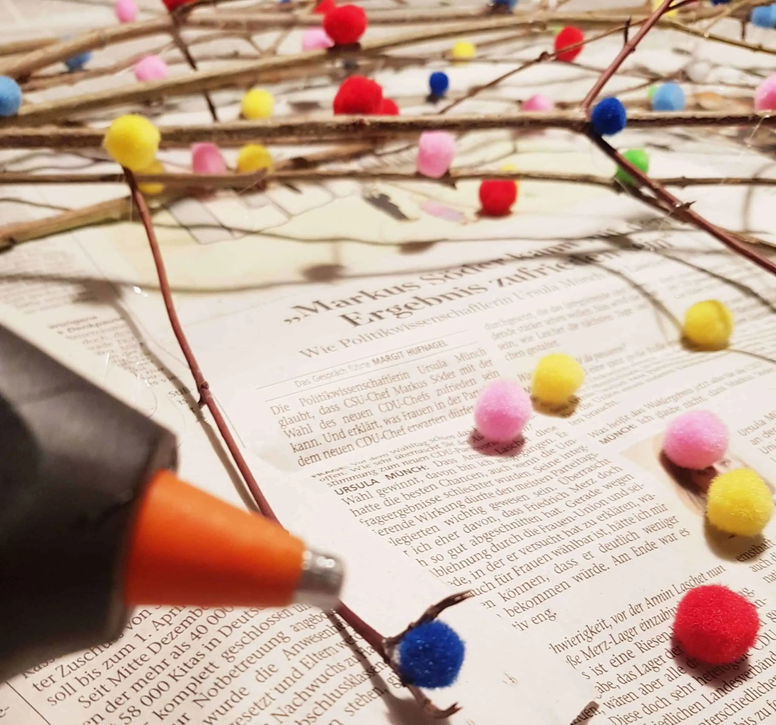 attach pom poms with hot glue gun